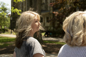 picture of mom and daughter outside walking away from camera